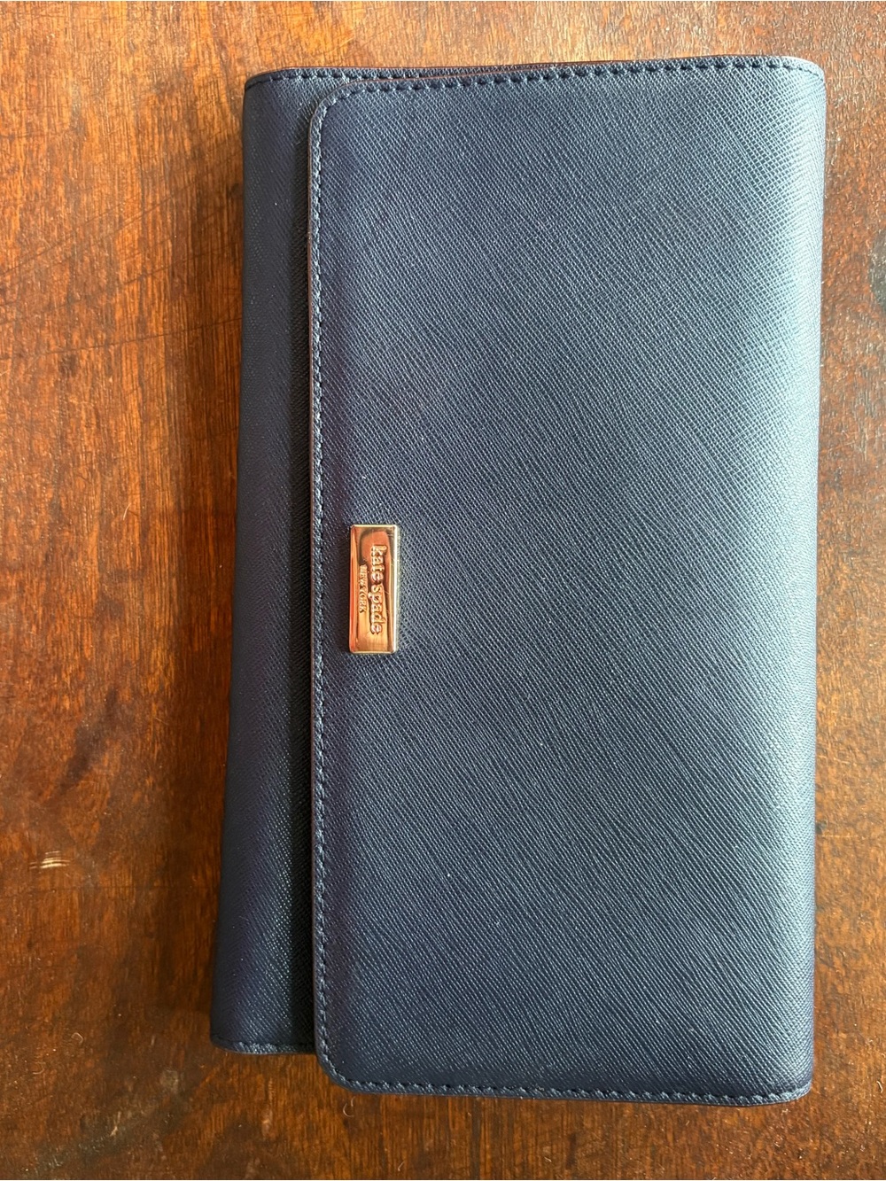 kate spade navy saffiano bifold wallet with gold logo plaque